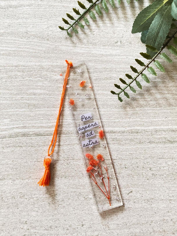 Orange baby breaths with silver foil flakes.