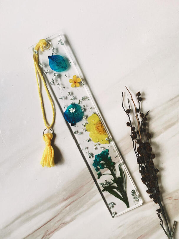 A mix of blue & yellow flowers with silver foil flakes.